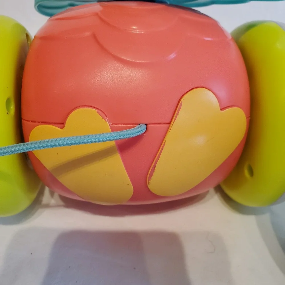 Fisher Price Paradise Pals Flamingo Roll A Round Rainbow Smile Face Pull Toys